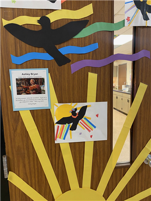 Image of student-created art in the style of Ashley Bryan. Art is displayed on classroom door.